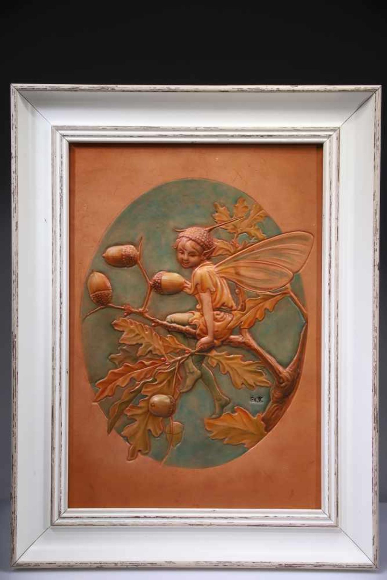 A FRAMED LEATHER CARVING