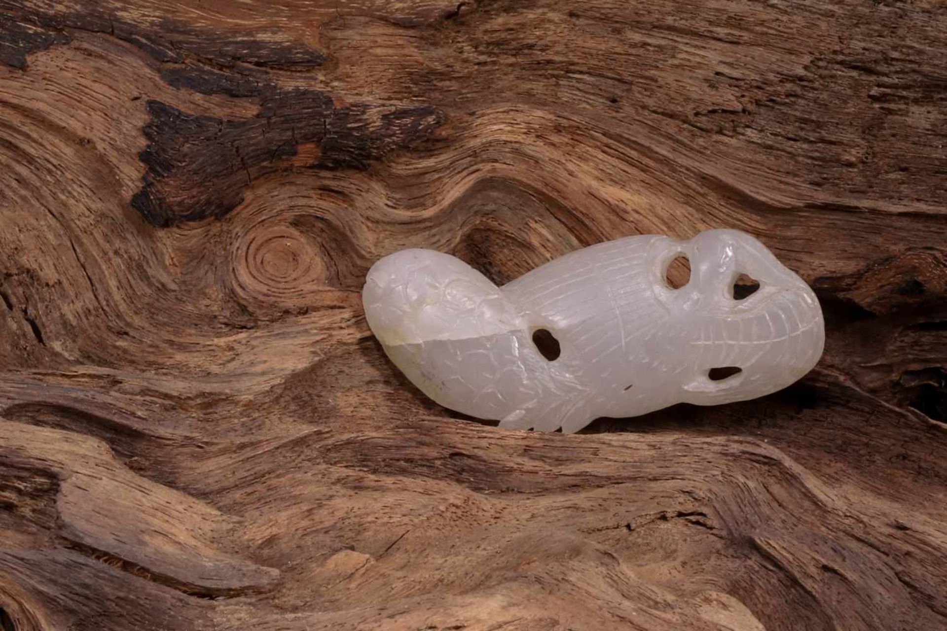 A WHITE JADE CARVED PHOENIX