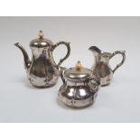 Vienna, 1865Silver tea setComprises a teapot, a sugar bowl, and a creamer. Ivory handles and