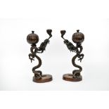 Late 19th century workPair of incense burnersBronze with dark brown patina, depicting stylized