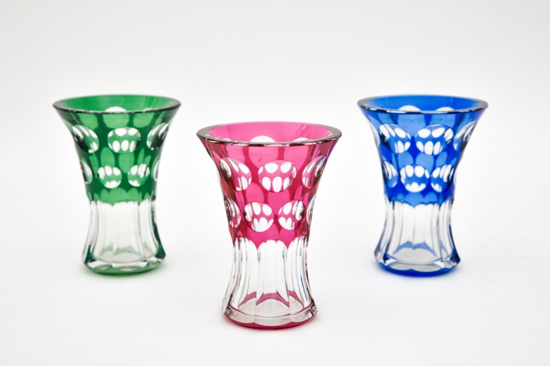 Val Saint LambertSet of three Art Deco vasesClear, green, red, and blue crystal. Each piece is