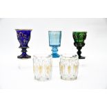 Bohemia, 19th centuryLot of faceted crystalComprises three footed glasses and two goblets. Gold