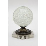 Stairwell postBubbled crystal, mounted on a silvery metal and glass stand. H: 11.5 cm