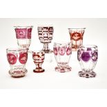 Bohemia, 19th centuryLot of 7 glasses Cut crystal with red-shaded décor. Some have inscriptions (