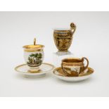 19th century Austrian workThree cups and two saucersPorcelain and gold, decorated with flowers,