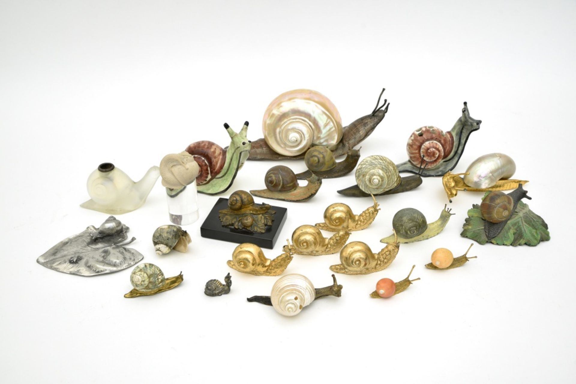 Collection of 23 snailsCeramic, bronze, opalescent glass, resin, pewter, and mother-of-pearl. Some