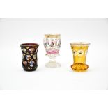 Bohemia, 19th centuryLot of painted cut crystalComprises three goblets, one made of yellow crystal