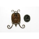 Lot of two intagliosOne oval-shaped depicting a young woman in front of two shields, the other