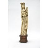 19th century Neogothic schoolMadonna and child crownedIvory sculpture with octagonal oak stand.