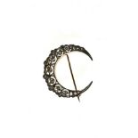 Crescent moon brooch 14 kt yellow and white gold, set with rose-cut diamonds. Ca. 1910 work.