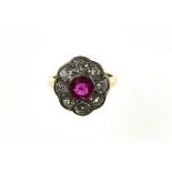 "Daisy" ruby ring 14 kt yellow and white gold, set with a round +/- 1 ct ruby in the centre,