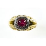 Signet ring 14 kt yellow and white gold, set with a ruby cabochon in the centre (slight crack).