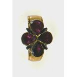 Garnet ring 18 kt rose gold set with 4 pear-cut garnets (one cracked) on paillon. Late 19th century
