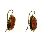 Pair of coral drop earrings 18 kt yellow gold, each set with a coral cameo depicting a female bust.