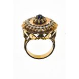 19th century ring 18 kt rose gold, round plaque set with a small sapphire in the centre surrounded