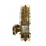 Hidden watch 18 kt yellow gold, set with 22 small ruby cabochons and 8 small brilliants. Fralux