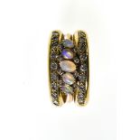 Opal ring band 18 kt yellow gold, set with 5 small oval opals and 2 rows of 10 small brilliants.