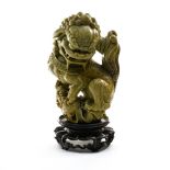 China, 20th century Chinese Imperial Guardian Lion, Soapstone, on a stand. Height (cm) : 22,5 - - -