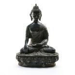 China, 19th century Buddha sitting on a double lotus throne, Bronze with black patina. Height (