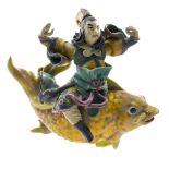 China, 20th century Immortal riding a fish, Polychrome majolica. On a stand. Height (cm) : 26 -