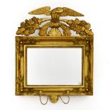 Empire-style work Mirror, Carved giltwood, topped with an eagle, with two candleholders underneath.