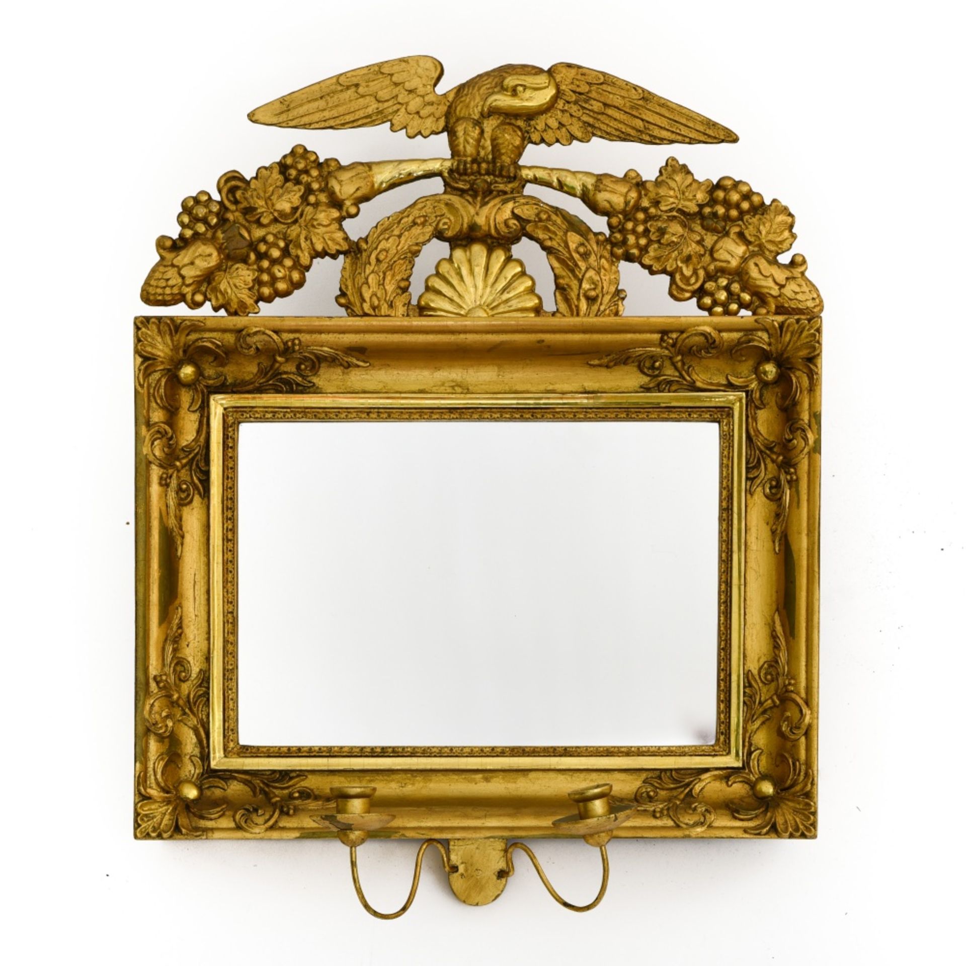 Empire-style work Mirror, Carved giltwood, topped with an eagle, with two candleholders underneath.