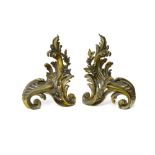 Louis XVI-style work Pair of andirons, Rocaille-style bronze with golden patina, decorated with