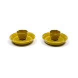 China, Qianlong Pair of teacups and saucers, Imperial yellow porcelain, with applied dragon