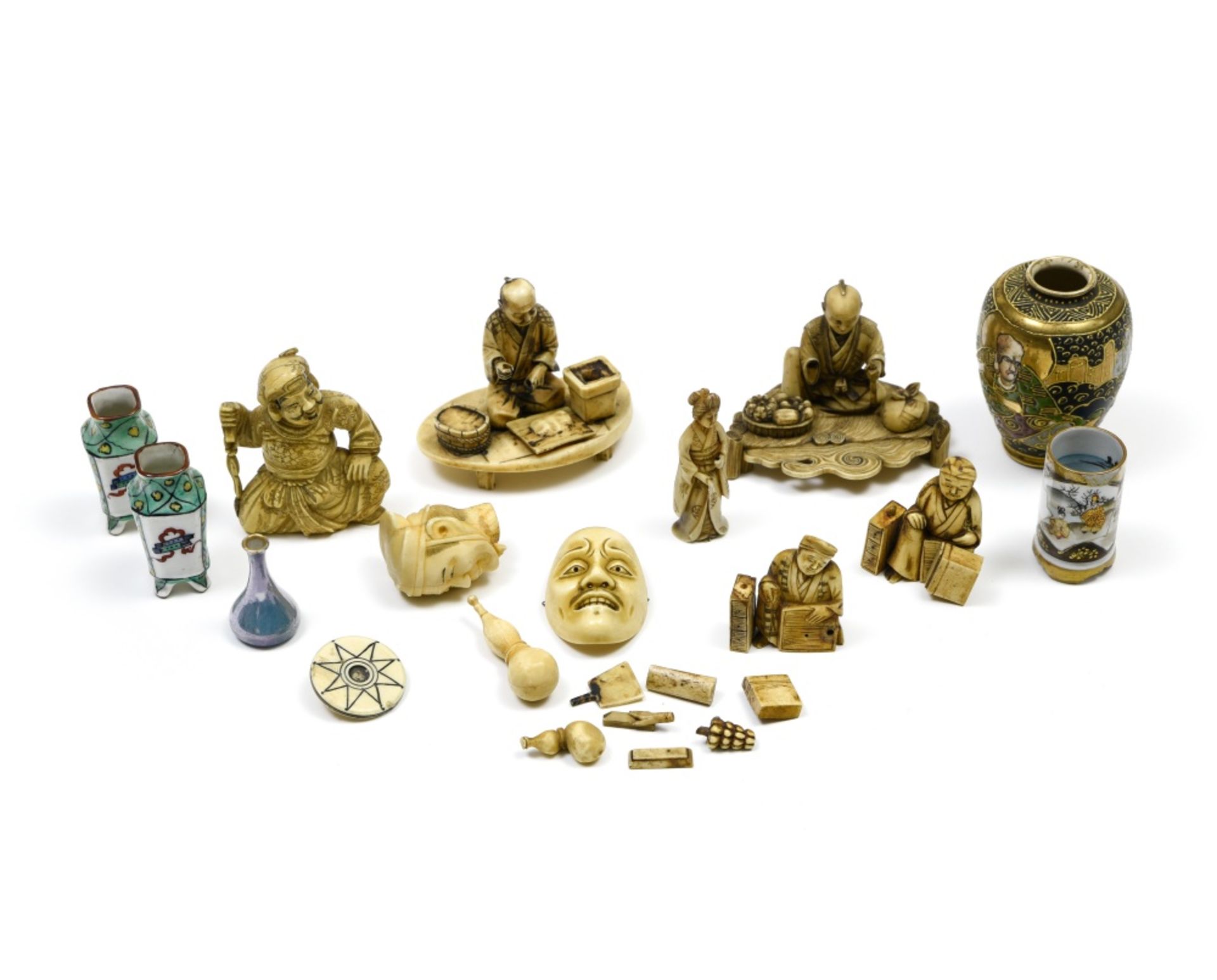 Japan, 19th century Lot of ivory and porcelain display items, Composed of seven small okimonos, a