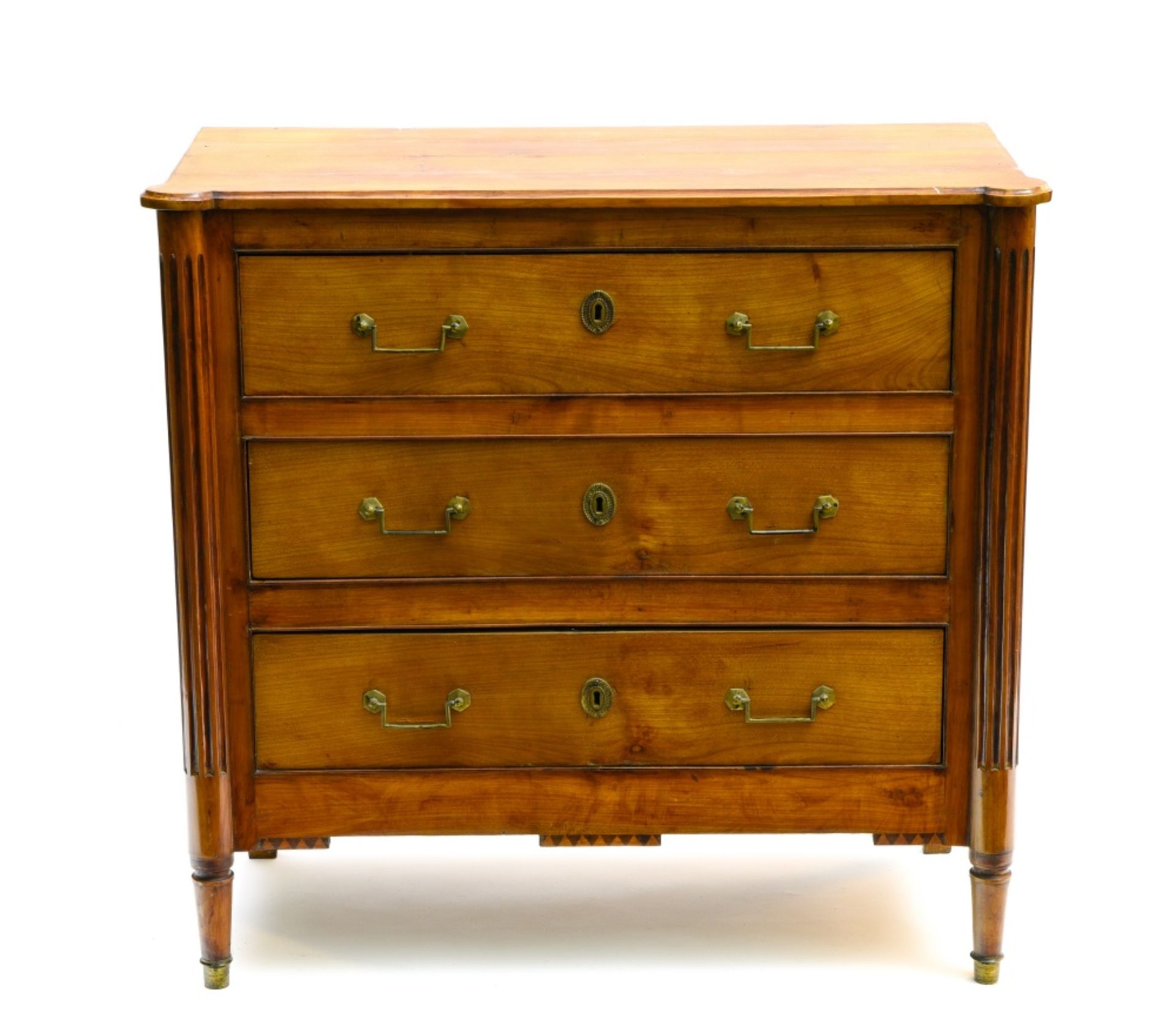 19th century work Commode, Lemonwood and lemonwood veneer, with three drawers and fluted legs.
