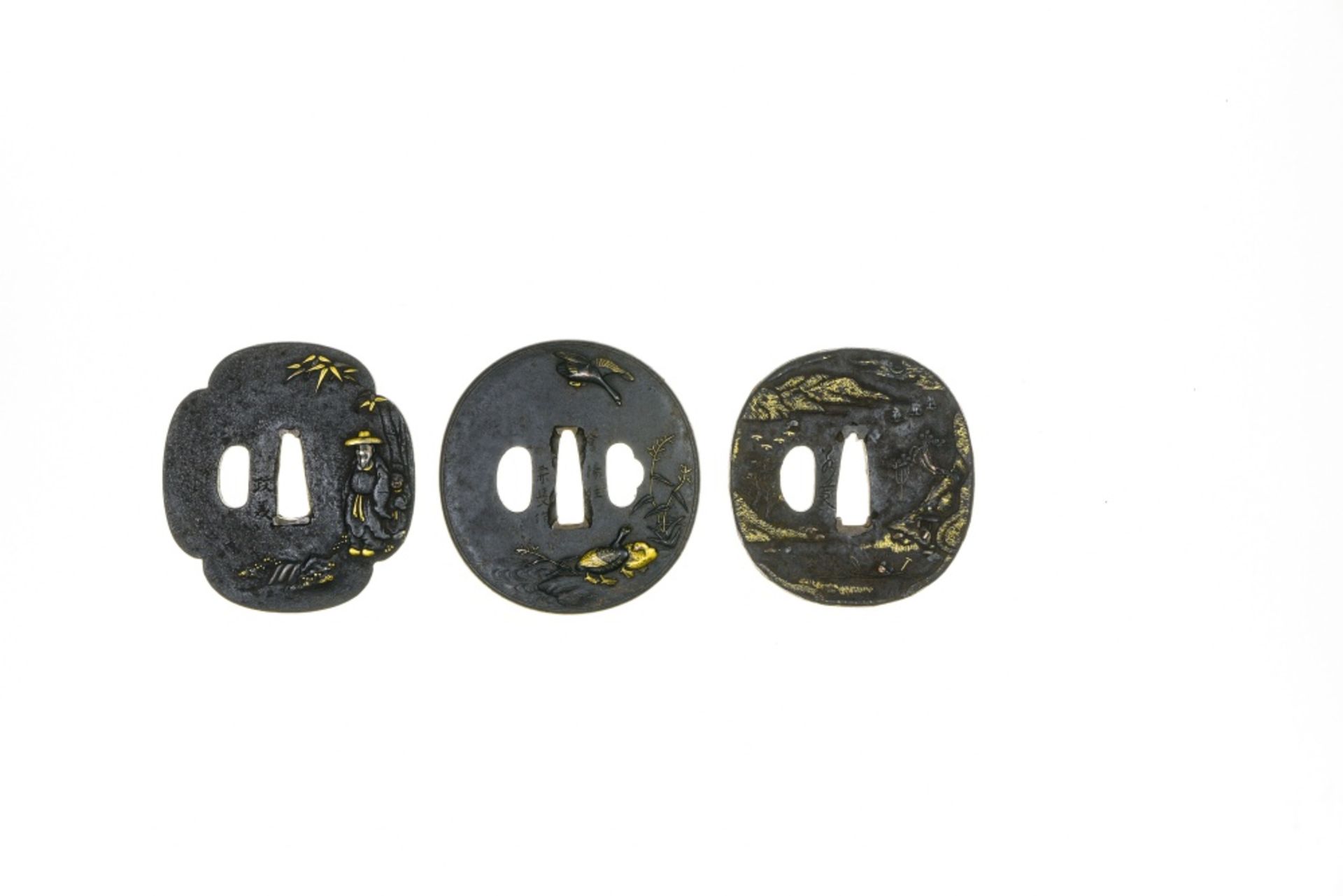 Japan, Edo Three tsubas, Iron, gilded in some spots, depicting a couple, ducks, and a lake and