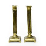 20th century work Pair of candlesticks, Bronze gilt, shaped like fluted columns. Height (cm) : 22,5