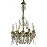 Napoleon III era work Large 12-branched chandelier, Bronze, brass, and glass, with crystal drops