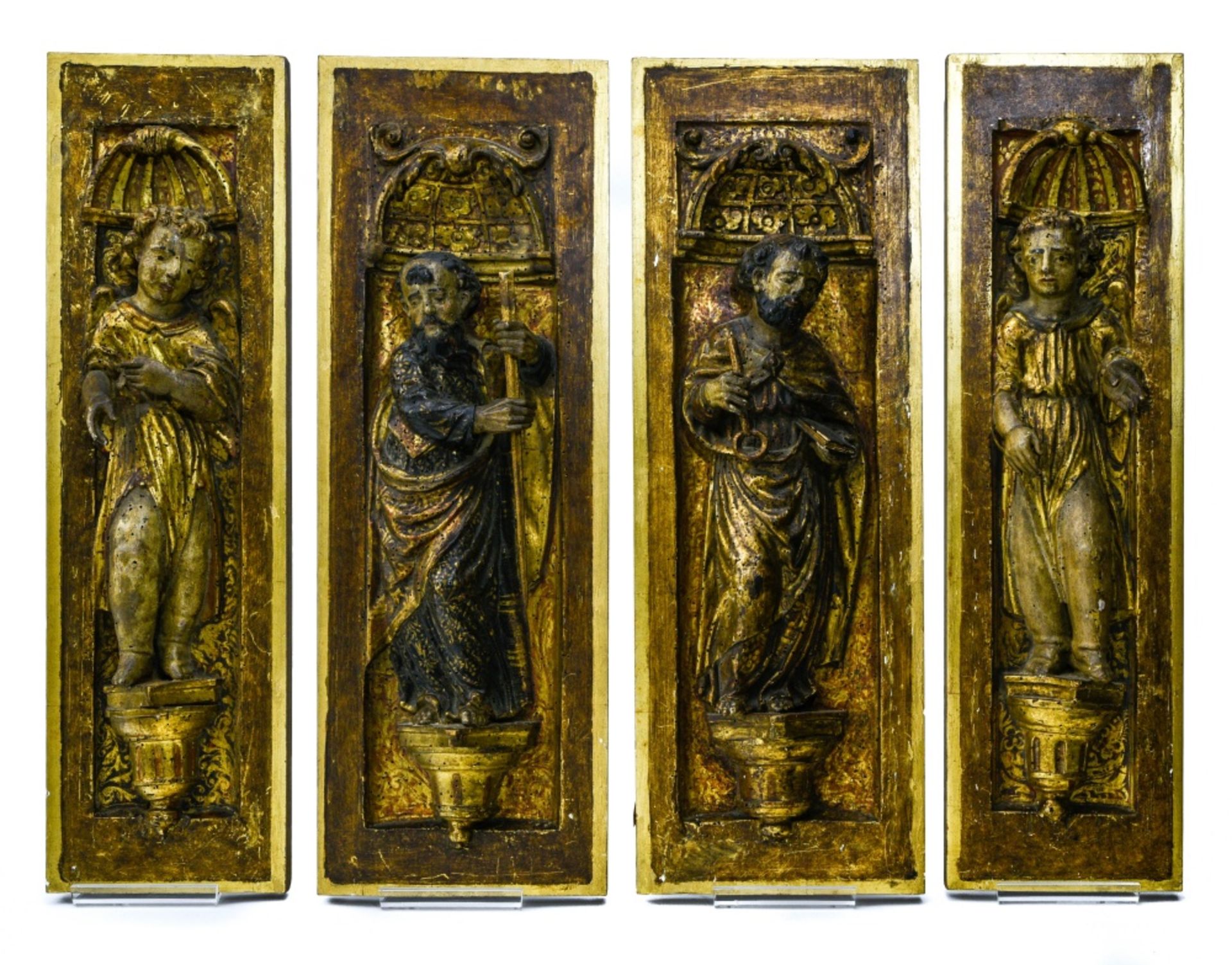 Spain, Castile, late 16th-early 17th century Set of four panels, Finely carved polychrome and gilt