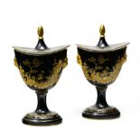 Late 19th-early 20th century work Pair of navette-shaped covered pots, Black and gold enamelled