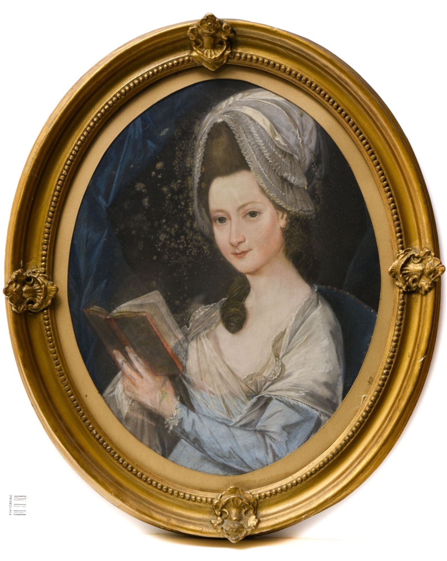 Late 18th century school Portrait of a woman with a quill pen, Oval pastel. Some mildew and
