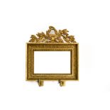 Directoire-style work Mirror topped with musical instruments, Gilt bronze with two candleholders.