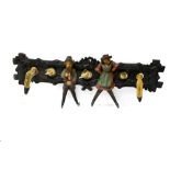 Black Forest work Coat and hat hooks, Carved and painted wood, horns and hooves, decorated with