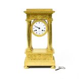 Restoration era work Portico clock featuring a lyre, Gilt bronze, enamelled dial signed Verdire,
