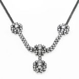 Diamond flower necklace 18 kt white gold, adorned with 4 flowers set with brilliants (+/- 0.25 ct