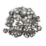 Flowering branch brooch 18 kt yellow gold and silver, set with rose-cut diamonds. Ca. 1880 work.