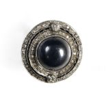 Art Deco hematite ring Platinum, round, set with a hematite cabochon (diam: 14 mm), surrounded by 2
