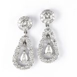 Pair of diamond drop earrings 18 kt white gold, teardrop-shaped, each set with a suspended pear-cut