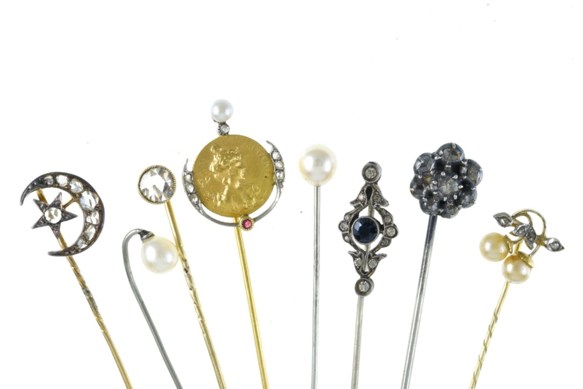 Set of eight tie pins Yellow gold and silver, rose-cut diamonds, pearls, and a "springtime"