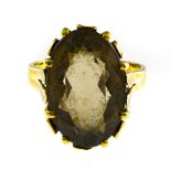 Smoky quartz ring 18 kt yellow gold, set with an oval-shaped smoky quartz. 1950s work. Hallmark: