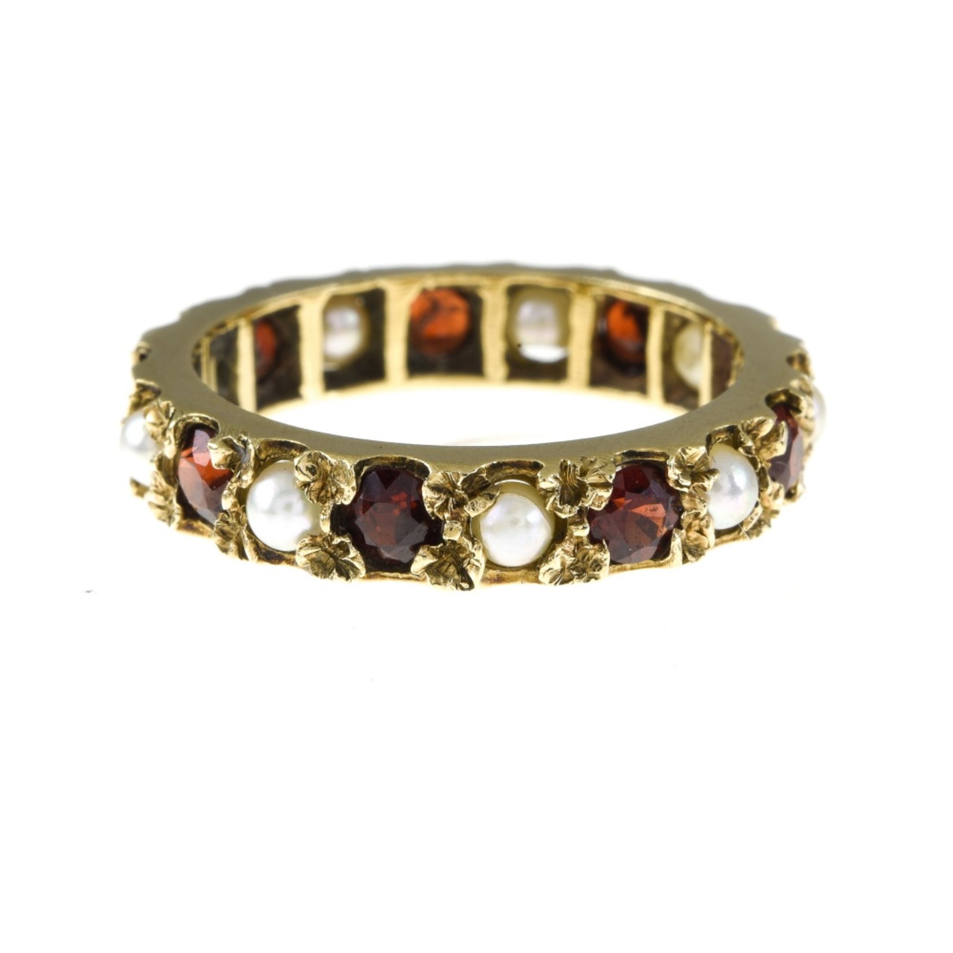 Victorian wedding band Yellow gold set with garnets and pearls. Late 19th century English work.