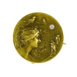 Small Art Nouveau brooch/pendant Distressed 14 kt yellow gold depicting a young woman's profile in