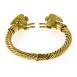 "Sphinx" bracelet 18 kt twisted yellow gold, hinged, adorned with a sphinx on either end. Hallmark: