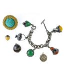 Lot of five pieces of costume jewellery Composed of a silver-plated metal charm bracelet adorned