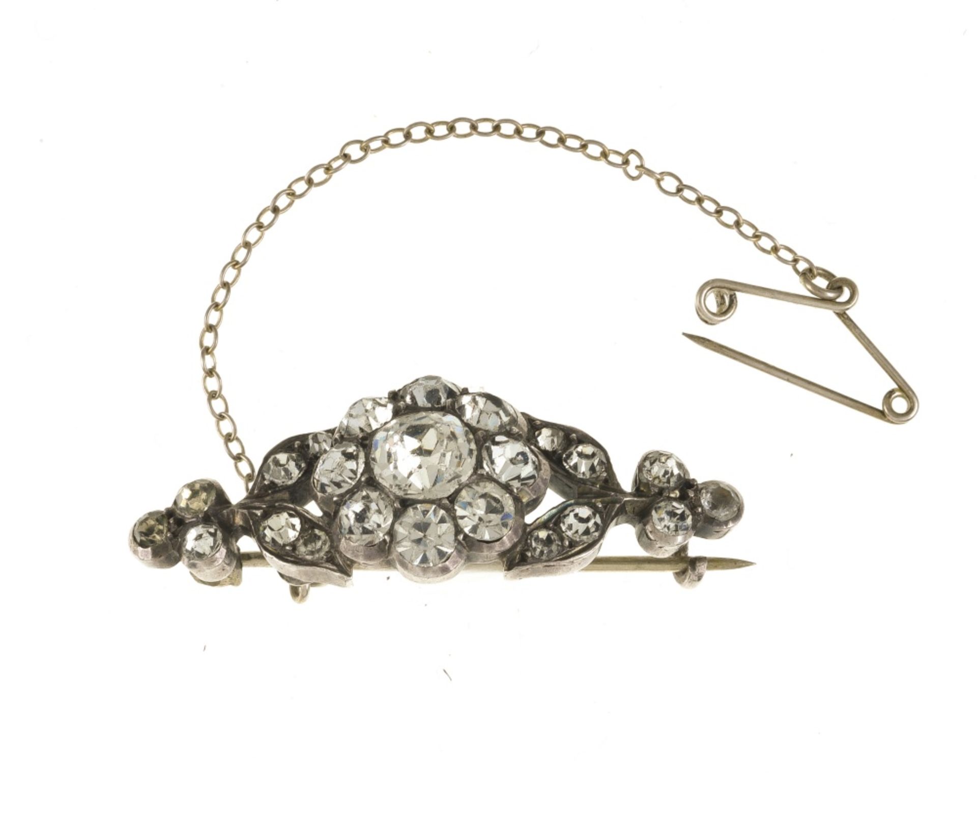 Rhinestone brooch-barrette Silver, adorned with a floral pattern set with rhinestones. Safety